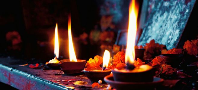 diya indian clay lamps with marigold flowers